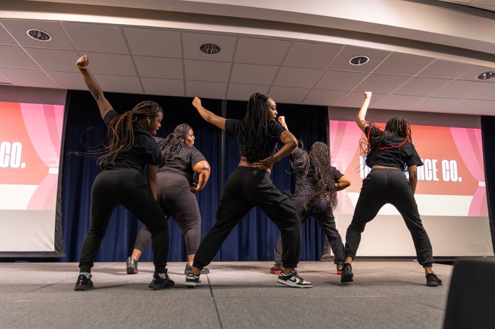 Dancers from Ignite Dance Co. striking a pose during their routine.